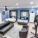 Main room inside Unit 1 at The Flight Deck Residences, showing lounge seating and sleeping area.