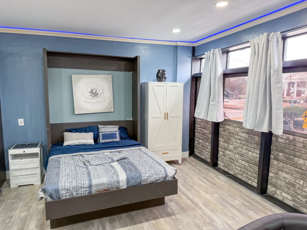 Murphy bed and wardrobe area inside Unit 1 at The Flight Deck Residences.