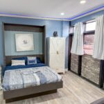 Murphy bed and wardrobe area inside Unit 1 at The Flight Deck Residences.