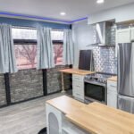 Kitchen with range and butcher block counter inside Unit 1 at The Flight Deck Residences.