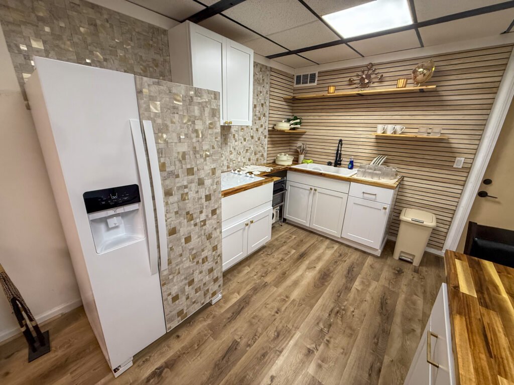 Kitchen and refrigerator inside Unit 2 at The Flight Deck Residences.
