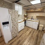 Kitchen and refrigerator inside Unit 2 at The Flight Deck Residences.