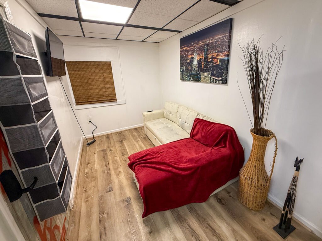 Living and sleeping area with daybed inside Unit 2 at The Flight Deck Residences.