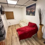 Living and sleeping area with daybed inside Unit 2 at The Flight Deck Residences.