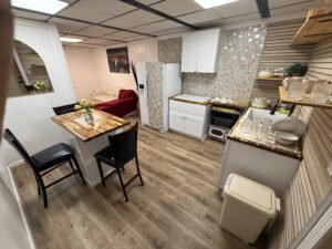 Open living space showing dining, kitchen, and lounge areas inside Unit 2 at The Flight Deck Residences.