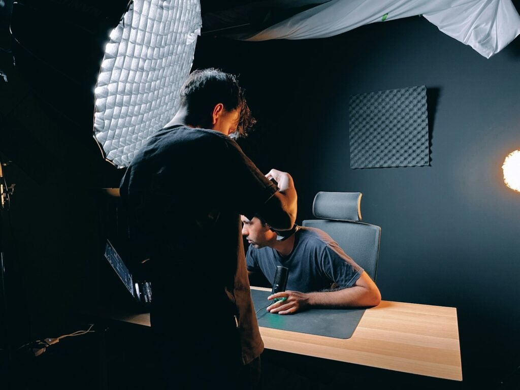Creator working at a desk beside a softbox light