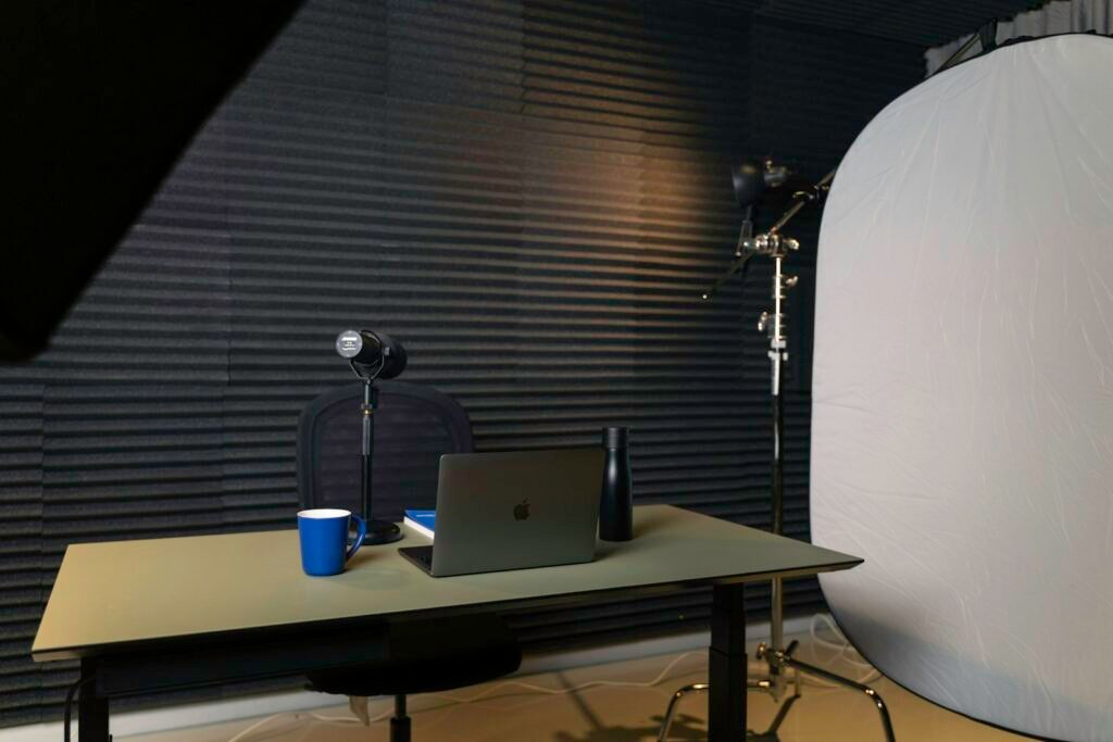 Podcast microphones set up on a desk