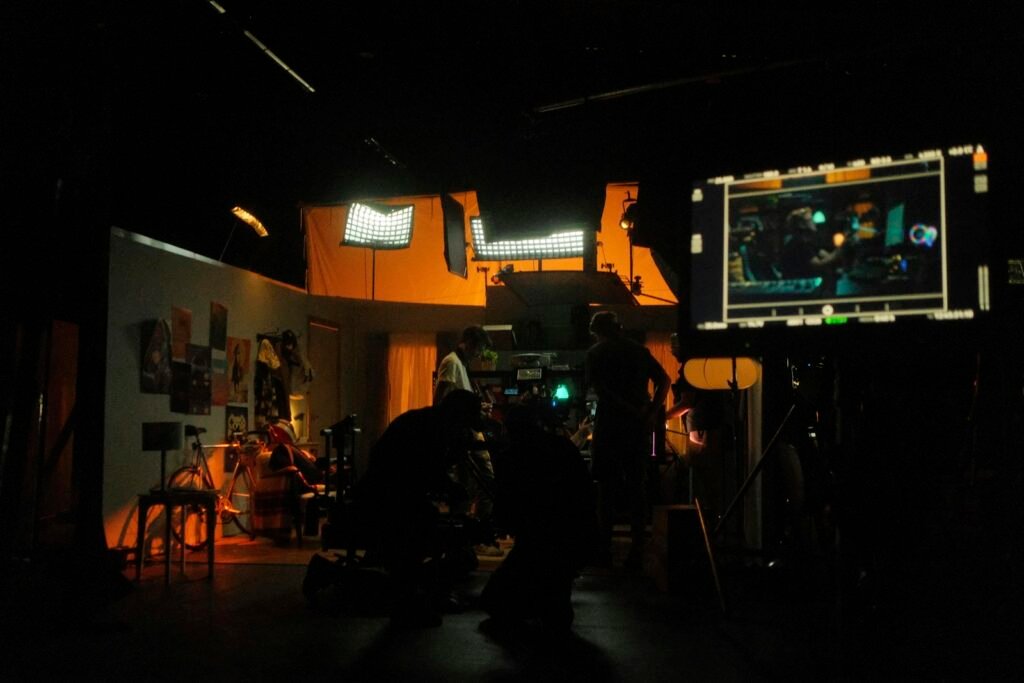Creator reviewing footage on a monitor during a shoot